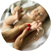 hands holding baby's foot