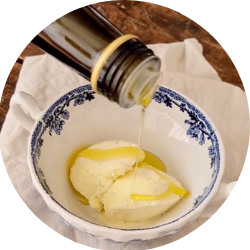 Vanilla ice cream in a bowl with olive oil