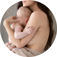 Half-naked woman holds baby